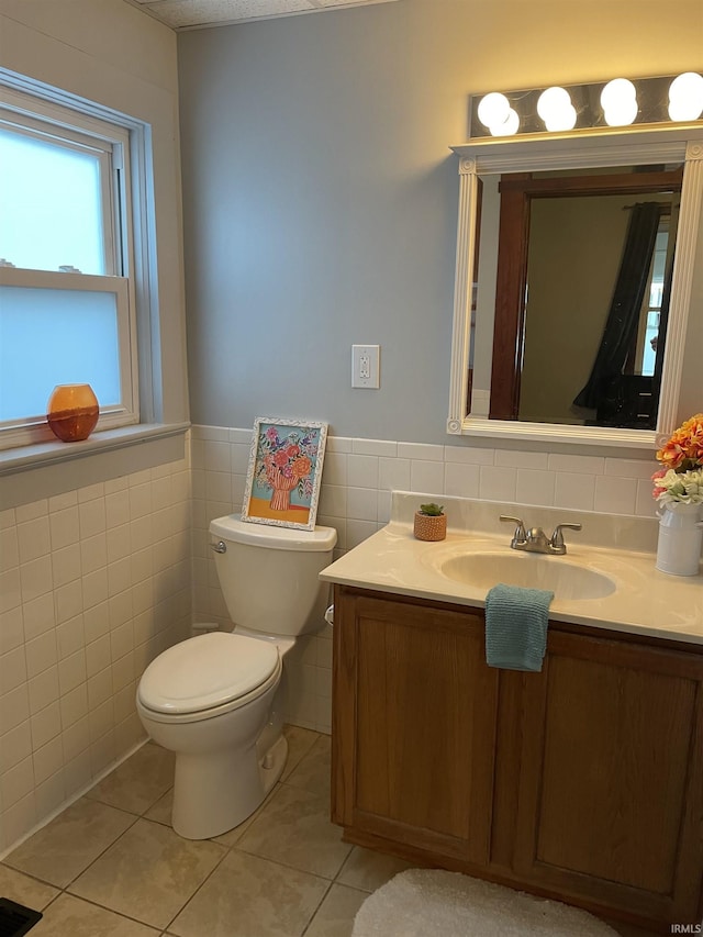 531 E 5th St, Mount Vernon, IN 47620 - half bathroom with tile walls, vanity, toilet, tile patterned flooring, and wainscoting