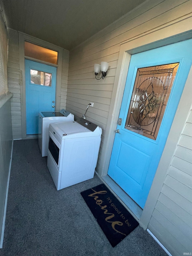 doorway to property featuring washer and clothes dryer