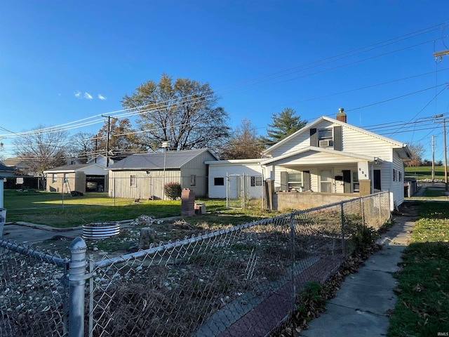 view of front of home featuring covered porch and a front yard