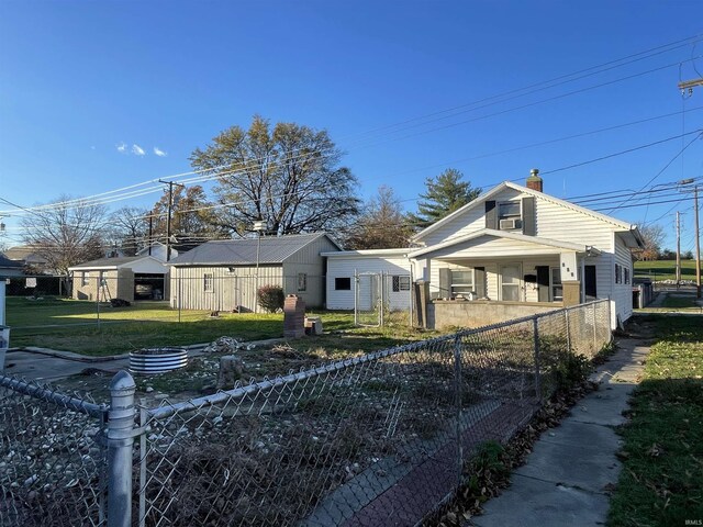 531 E 5th St, Mount Vernon, IN 47620 - view of home's exterior with a chimney and covered porch
