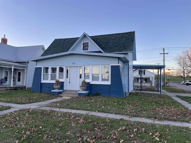 531 E 5th St, Mount Vernon, IN 47620 - bungalow featuring a shingled roof, brick siding, and a front yard