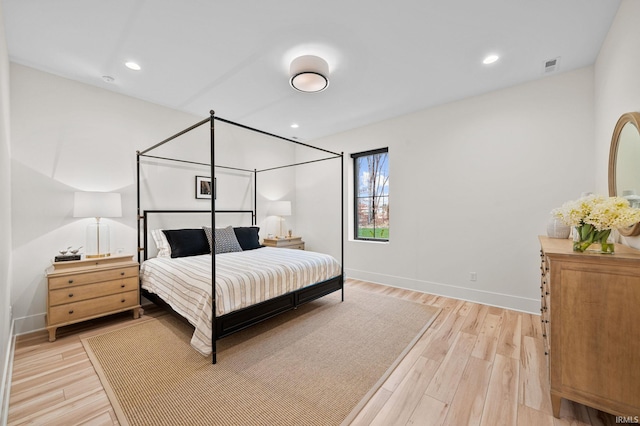 bedroom with light wood-type flooring