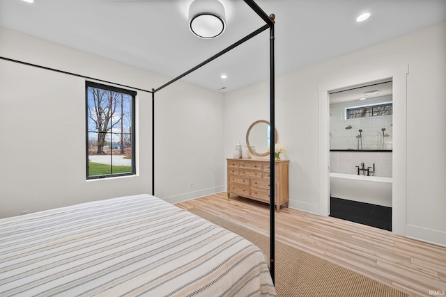 bedroom with light hardwood / wood-style floors