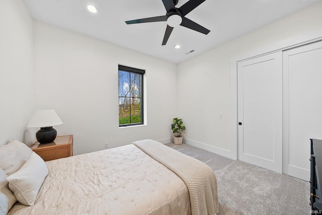 bedroom featuring light carpet and ceiling fan