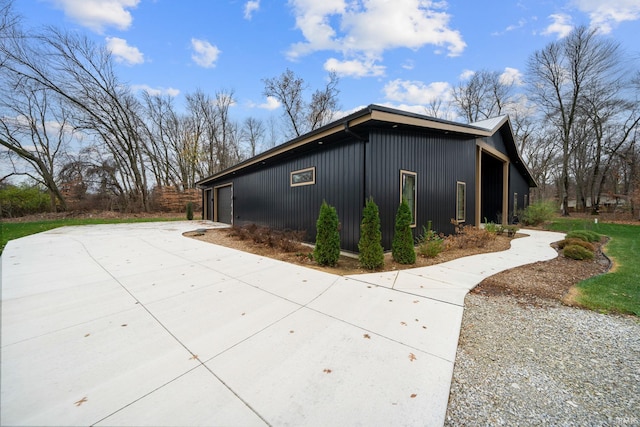 view of side of home with a garage