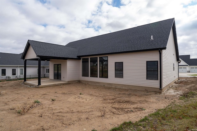 rear view of property featuring a patio area