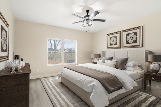 bedroom featuring ceiling fan and hardwood / wood-style flooring