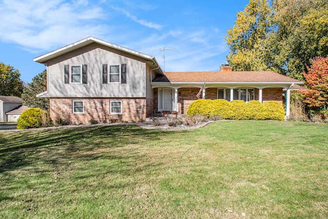 split level home with a front lawn