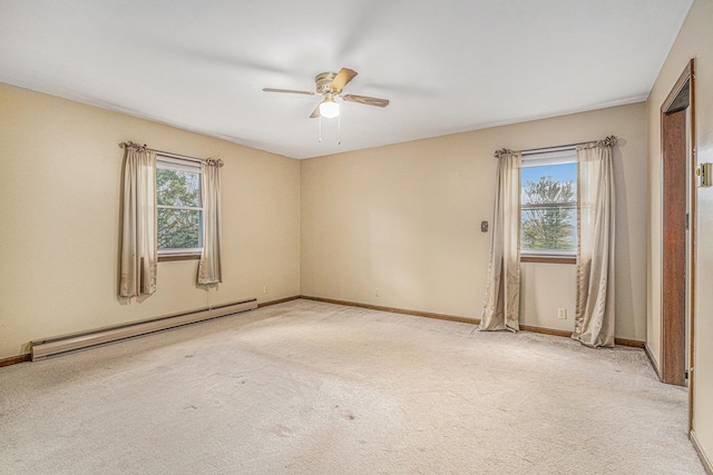 spare room featuring ceiling fan, light colored carpet, and a baseboard radiator