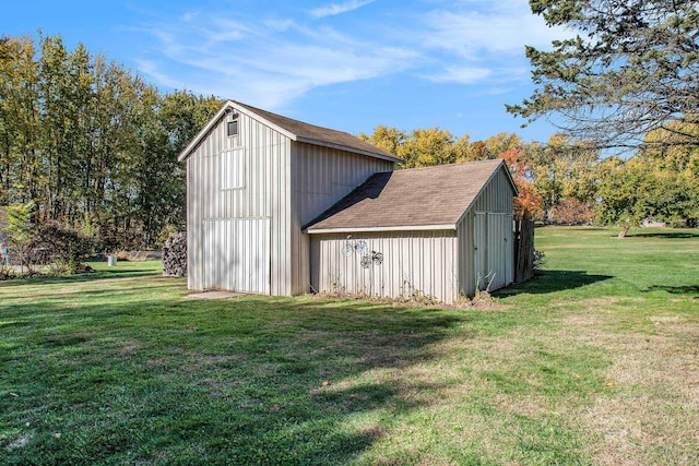 view of outdoor structure featuring a lawn