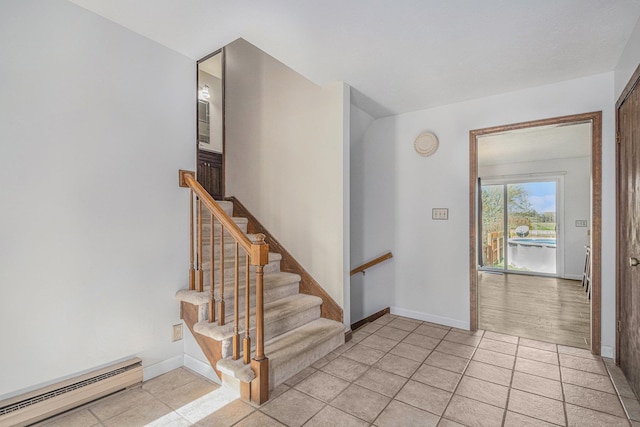 tiled entryway with baseboard heating