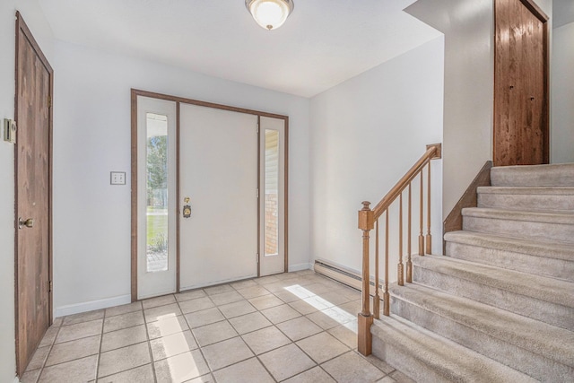 tiled entryway with baseboard heating