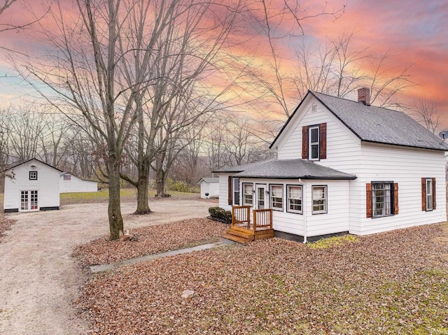 view of back house at dusk