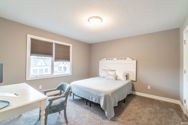 carpeted bedroom with a textured ceiling