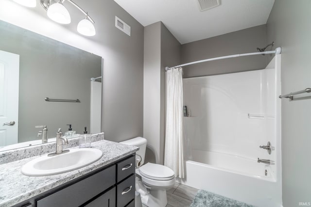 full bathroom featuring vanity, toilet, and shower / bath combo with shower curtain