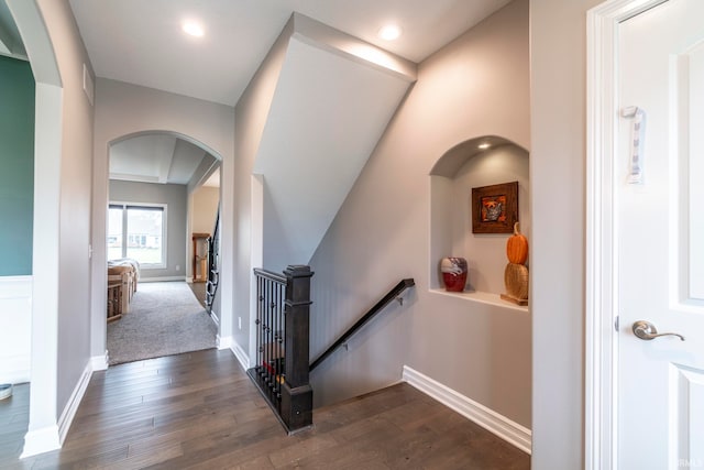 hall with dark hardwood / wood-style flooring