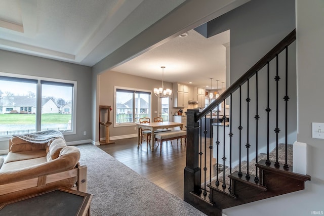 interior space featuring dark hardwood / wood-style floors and a notable chandelier