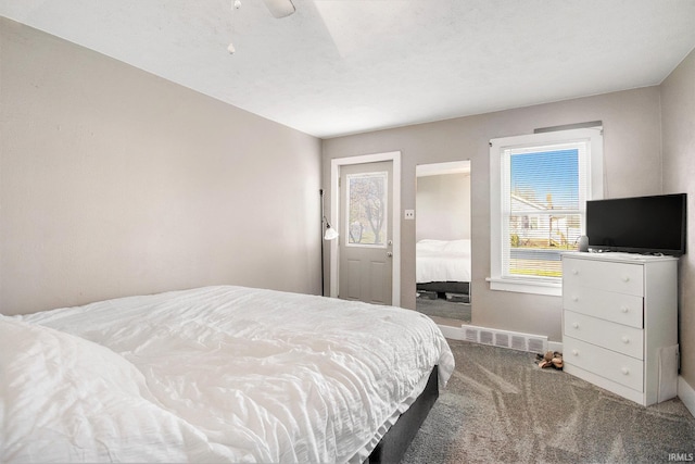 bedroom with carpet, ceiling fan, and a textured ceiling