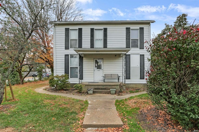 view of front property with a porch and a front yard