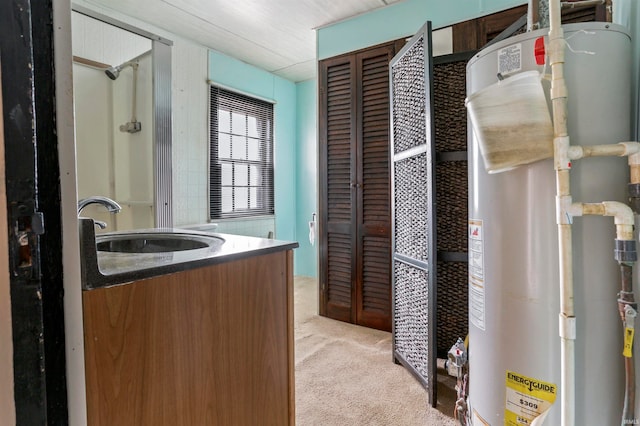 bathroom with water heater and vanity