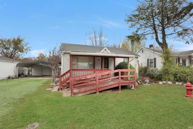 view of front facade featuring covered porch, a front lawn, and a carport