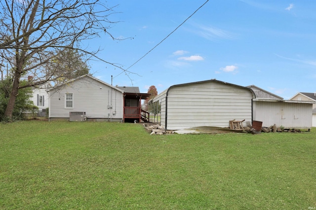 back of property with a lawn