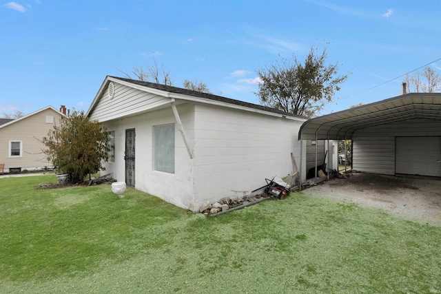 view of side of property with a yard and a carport