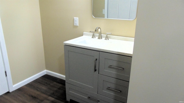 114 E Mill St, Oakland City, IN 47660 - bathroom featuring vanity, wood finished floors, and baseboards