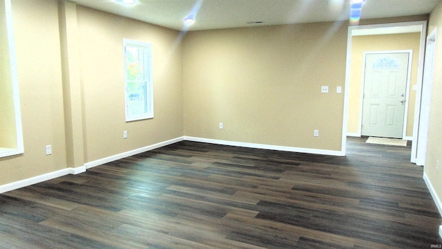 114 E Mill St, Oakland City, IN 47660 - spare room with dark wood-style flooring and baseboards