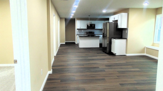 kitchen featuring decorative backsplash, dark hardwood / wood-style flooring, white cabinets, and black appliances