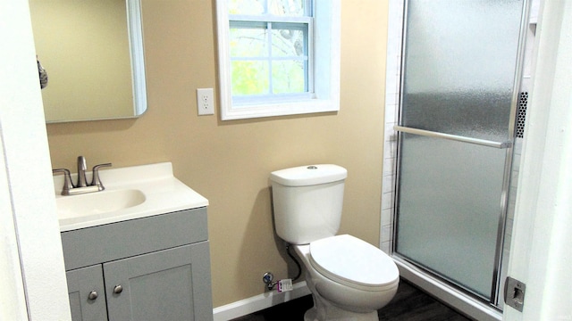 114 E Mill St, Oakland City, IN 47660 - bathroom with vanity, a stall shower, and toilet