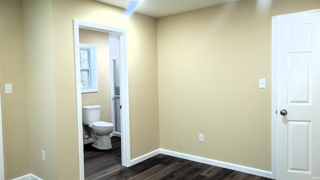 hall with dark wood-type flooring