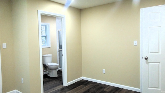 114 E Mill St, Oakland City, IN 47660 - corridor featuring dark wood-style flooring and baseboards