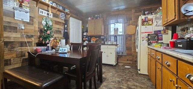 dining area with wooden walls