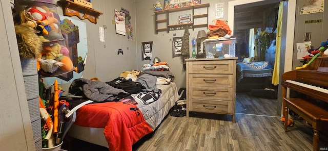 bedroom with dark wood-type flooring