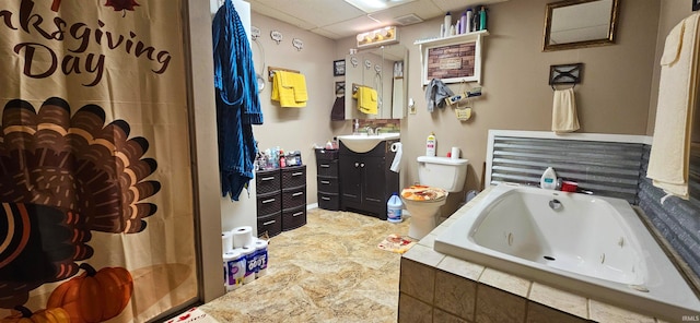 bathroom with vanity, a drop ceiling, and independent shower and bath