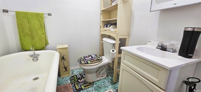 bathroom featuring vanity, toilet, and a bathing tub