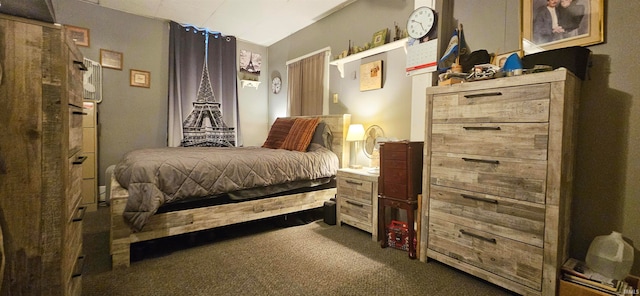 carpeted bedroom featuring lofted ceiling