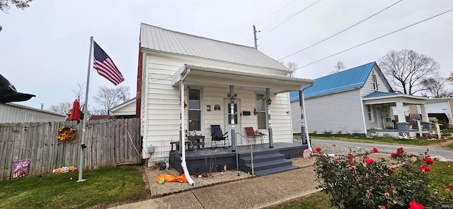 bungalow-style home with a front yard and a porch