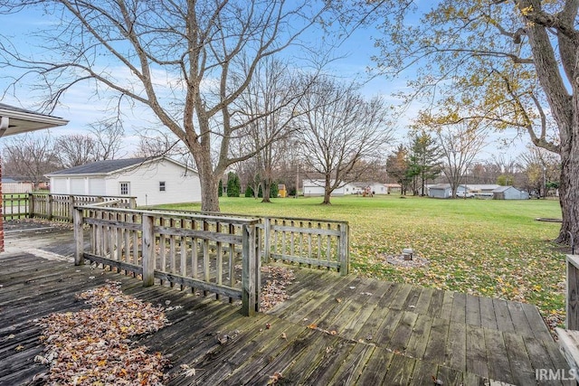 wooden deck with a yard