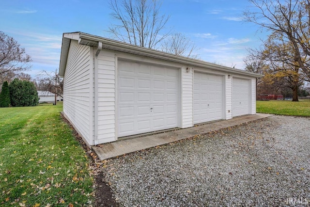 garage with a lawn