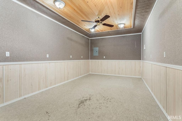 unfurnished room with ceiling fan, wooden ceiling, and carpet floors