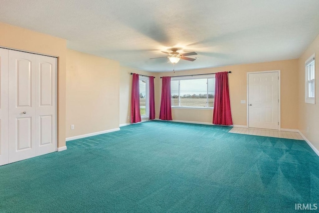 interior space featuring ceiling fan