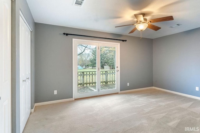 empty room with light carpet and ceiling fan