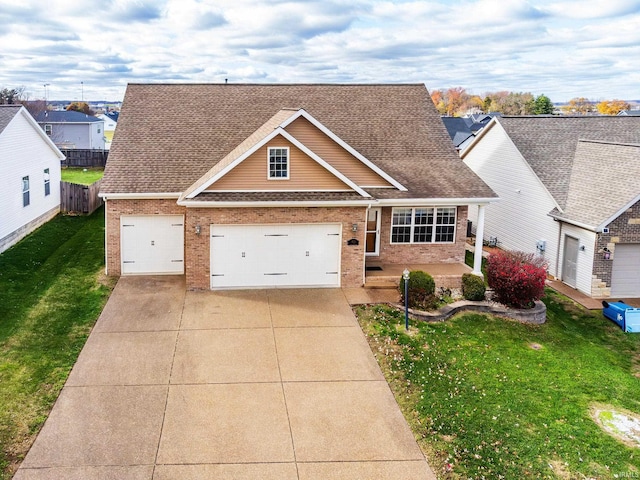 view of front of property with a front yard and a garage