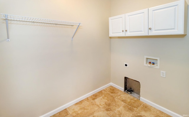 laundry room with electric dryer hookup, cabinets, and washer hookup