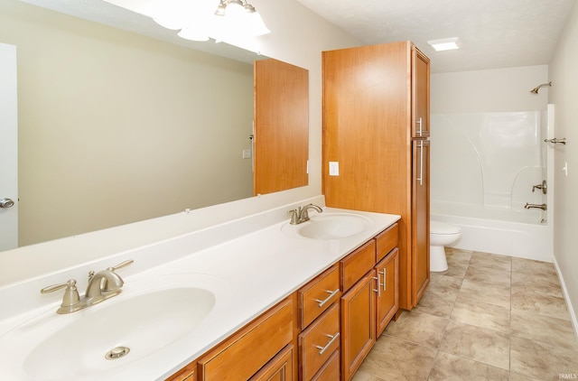 full bathroom featuring a textured ceiling, vanity, shower / bathtub combination, and toilet