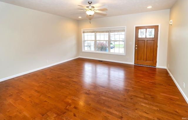 foyer featuring dark hardwood / wood-style flooring and ceiling fan