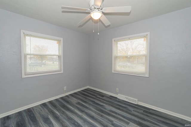 unfurnished room featuring ceiling fan and dark hardwood / wood-style flooring