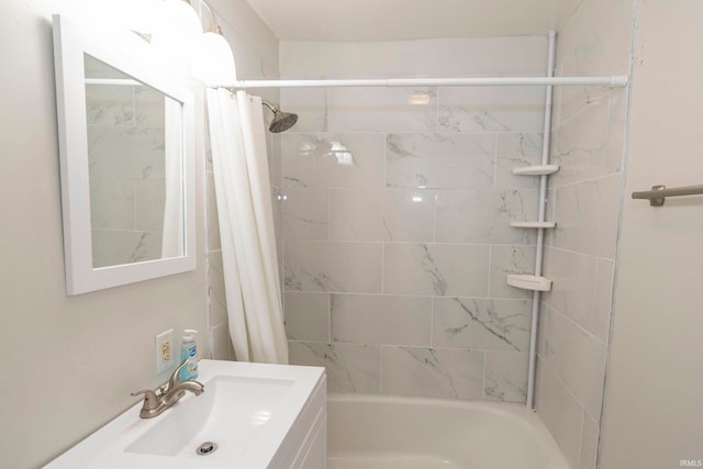 bathroom with shower / tub combo and sink